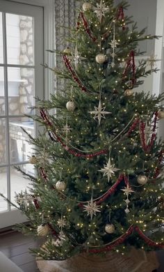 a decorated christmas tree in a living room