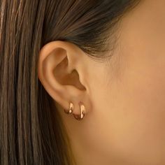 14K Solid Rose Gold small huggie earrings with a thick width. Perfect to wear alone or stacked with other huggies in our collection. 14K Rose Gold Hypoallergenic, lead and nickel free Width 3mm Inside Diameter:6mm, 7.5mm Weight: 0.8g, 0.9g Click close mechanism #ES034-6RG Gold Hoop Earrings Double Piercing, Good Huggie Earrings, Two Gold Hoop Earrings, 2 Ear Piercings Ideas Simple Gold, Mini Hoops Earrings, Small Gold Hoops Earrings, Gold Mini Hoop Earrings, Mini Earrings Gold, Sleek Gold Earrings