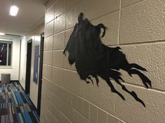 a hallway with a horse painted on the wall