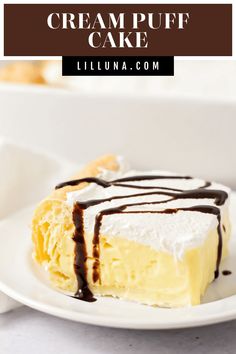 a piece of cream puff cake on a white plate with chocolate drizzles