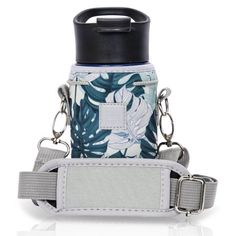 a blue and white flowered bottle holder with two straps on the front, and a black top