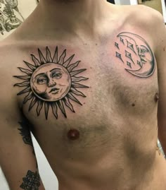 a man with two sun and moon tattoos on his chest