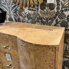 a large wooden dresser sitting in front of a wall