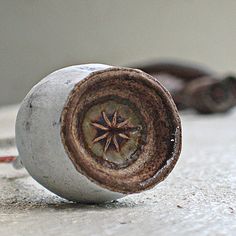 an old metal object sitting on the ground