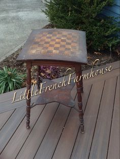 an old wooden table with a chess board on it's top and the words little french furniture