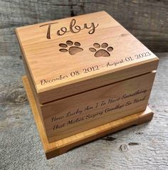 a wooden box with the words today written on it and two paw prints in black ink