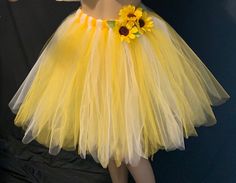 "This Beautiful sunflower tutu is Multi-Layered. Comes in two length, above the knees and knee length. This Blooming Sunflower tutu is made from Rich Vibrant Yellow and Deep Bold white tulle material. The sewed on Sunflowers attached to the waistline is a nice accent to enhances the overall theme of the skirt. Handmade from 100% Polyester(Tulle). Soft, Comfortable 1 inch Elastic Waistband. Lightweight and fun to wear. The same length are Available in your favorite colors as well , please leave t Fitted Yellow Tutu Dress With Tulle Skirt, Yellow Tutu Dress With Tulle Skirt For Spring, Spring Yellow Tutu Dress With Tulle Skirt, Yellow Tulle Tutu Dress For Spring, Spring Yellow Tulle Tutu Dress, Yellow Tutu Skirt, Sunflower Tutu, Plus Size Tutu, Bumble Bee Costume