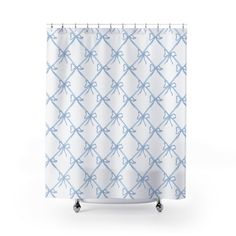 a blue and white shower curtain with an abstract pattern in the middle, on wheels