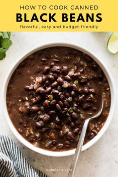 a white bowl filled with beans and garnished with cilantro