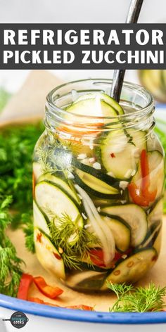 a jar filled with pickled zucchini on top of a wooden cutting board