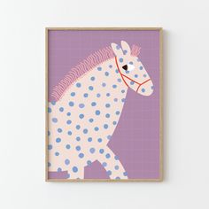 a purple and white horse with polka dots on it's body is framed in wood