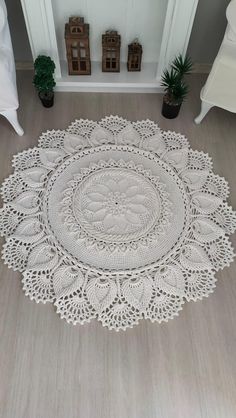 a large white doily is on the floor