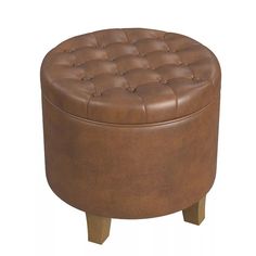 a brown leather ottoman with wooden legs and buttoned buttons on the top, sitting in front of a white background