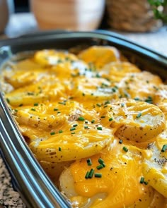 a casserole dish with potatoes and cheese