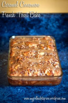 caramel cinnamon french toast bake in a glass baking dish on a blue surface