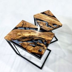 three wooden tables sitting on top of each other with black metal bases and wood tops