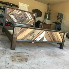 a bed frame made out of wood in a garage