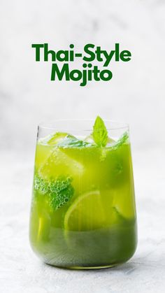 a glass filled with green liquid and lime slices on top of it, next to the title that says thai style mojito