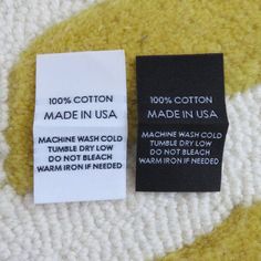 a label on the back of a sweater that says made in usa and machine wash cold tumbler dry low do not reach warm