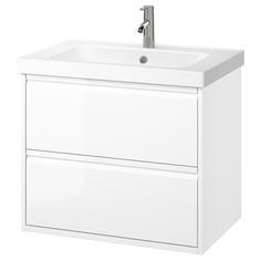 a white bathroom vanity with two drawers and a faucet on the sink side