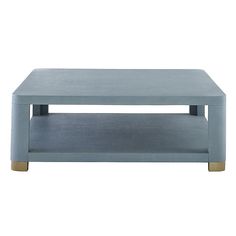 a light blue coffee table with gold legs