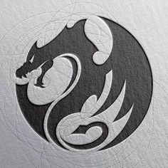 a dragon logo is shown on the side of a white and black circle with circles around it