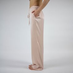 The Silk Dreamscape pants are designed from washable, 100% Mulberry Silk. It is made by specialized farms where silkworms are fed organic mulberry leaves. The pants feature a simple straight cut and have a drawstring waist that's easy to adjust for night-long comfort and pockets.  A contrasting Transcendent Pink colour offers stability and a comforting cocooning quality. Wear it alongside a shirt for a trendy look, or layer it with a camisole or kimono for added flair. Easy to match and wear!The Silk Trousers For Loungewear, Relaxed Fit Silk Trousers, Silk Wide-leg Pants With Relaxed Fit, Silk Bottoms With Elastic Waistband And Straight Leg, Silk Wide Leg Bottoms With Relaxed Fit, Silk Straight Pants For Loungewear, Silk Long Pants For Loungewear, Silk Loungewear Pants, Pink Silk Pants