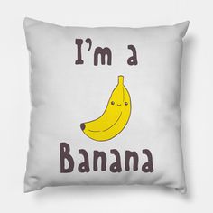 a white pillow with a yellow banana printed on it's side that says i'm a banana