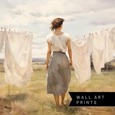 a painting of a woman standing in front of some laundry hanging on a clothes line