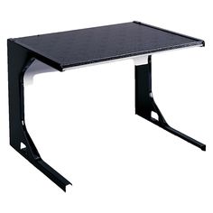 a black and white desk sitting on top of a metal stand up table with two legs