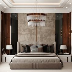 a bedroom with a large bed and chandelier hanging from it's ceiling