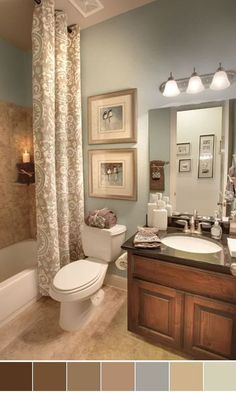 the bathroom is decorated in shades of brown and blue, with neutrals on the walls