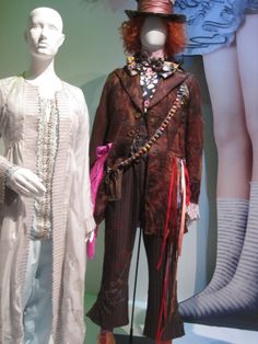 two mannequins dressed in costumes and hats