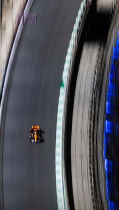 an aerial view of a race car driving on a track