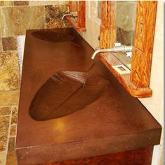 a bathroom sink made out of wood and metal