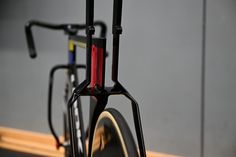 a close up of a bike with its rear wheel still attached to the handlebars