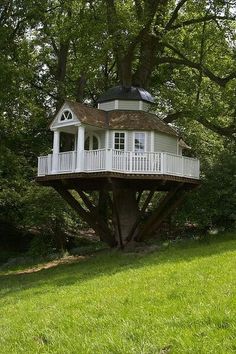 a tree house in the middle of a field