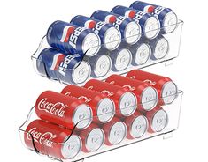 six cans of coca - cola stacked on top of each other in a clear holder