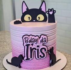 a birthday cake decorated to look like a cat