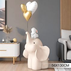 an elephant and a mouse are flying in the air with balloons attached to their backs