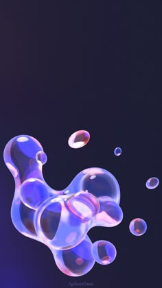 soap bubbles floating in the air on a black background