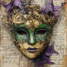 a green mask with purple flowers on top of an old piece of paper that is covered in writing