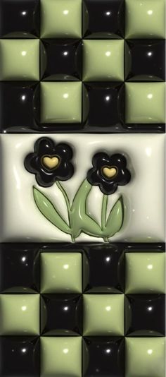 two black and green flowers are in the middle of a checkered tile wall pattern