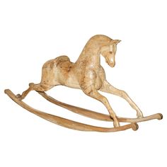 a wooden rocking horse on a white background