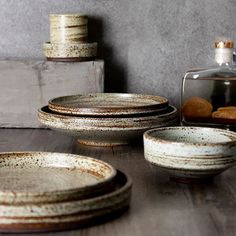 the dishes are sitting on the table ready to be used as desserts or dinnerware