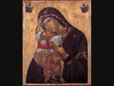 an icon of the mother mary holding a baby jesus in her arms and wearing a red scarf