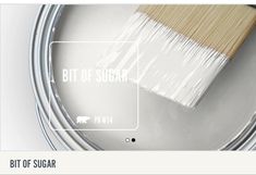 a paint can with a brush on top of it that says, bit of sugar