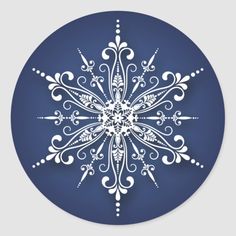 a blue and white snowflake with swirls on it