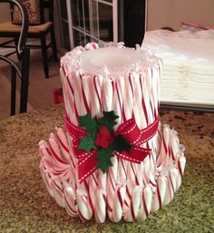 a candy cane christmas hat sitting on top of a counter