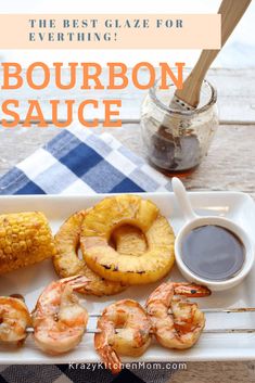 the best glaze for everything bourbon sauce and shrimp on a platter with corn